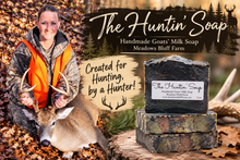Load image into Gallery viewer, Meadows Bluff Farm handmade hunting goats’ milk soap with activated charcoal, shown alongside its creator on a deer hunt.